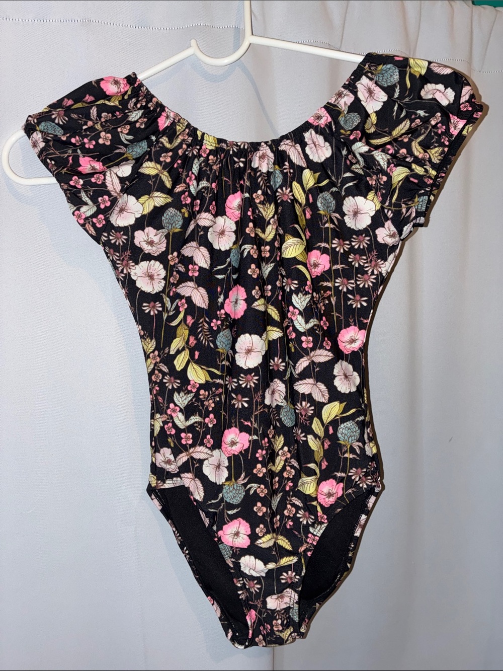 Kid’s black floral one-piece swimsuit with cap sleeves in EUC